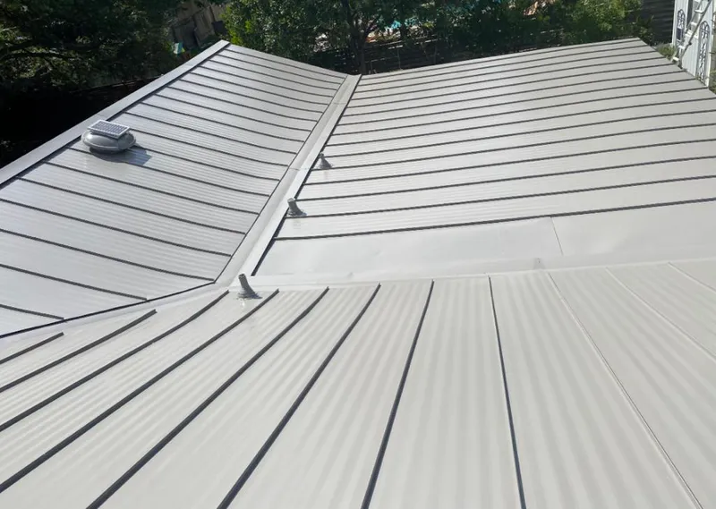 Solar attic fan installed on a metal roof for Roof Ventilation in Lomita